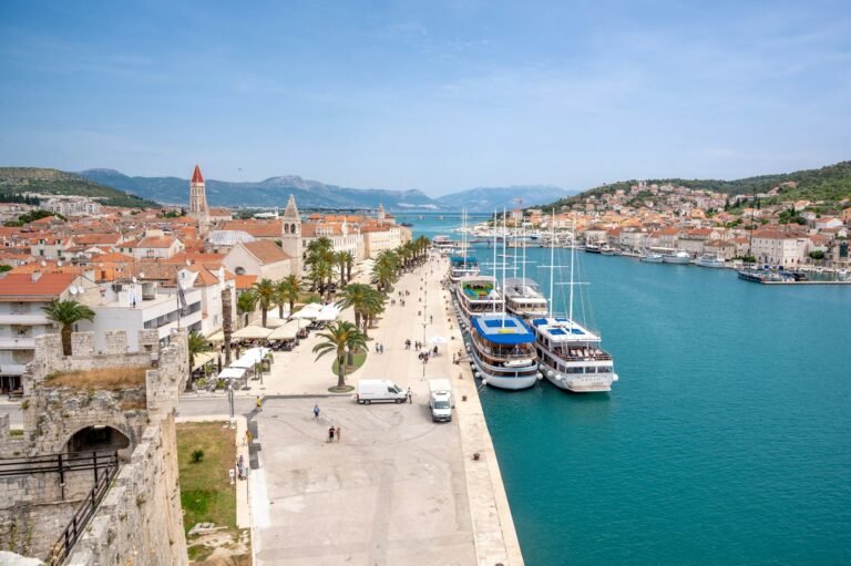 Trogir old town waterfront with boats moored along the promenade